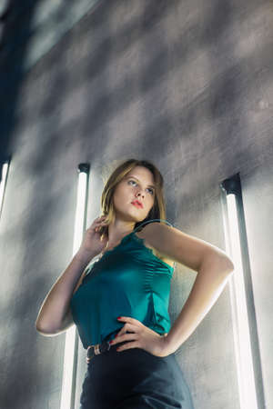 Very beautiful girl posing in a room with lamps, model business.の写真素材