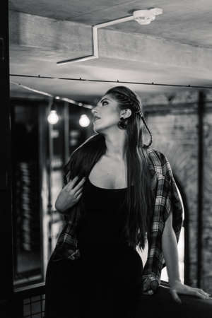 Beautiful and sexy girl posing in a cafe. Loft style.の写真素材