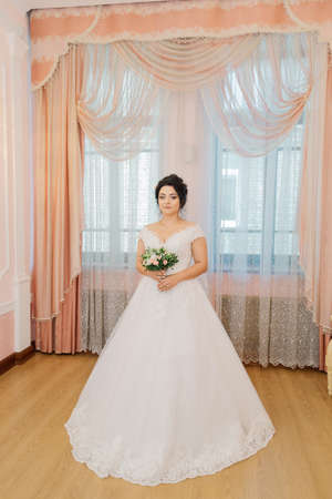 Beautiful bride in a gorgeous dress and bouquet.の写真素材