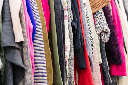 Clothes on hangers in shop. Close up.の写真素材