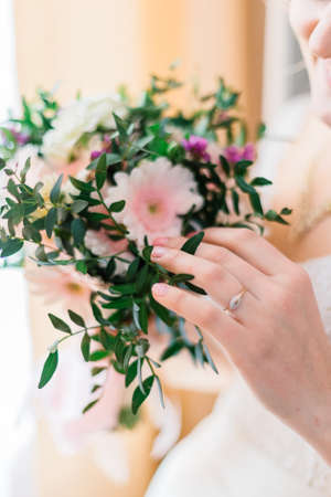 Very beautiful bridal bouquet in the hands of the bride.の写真素材