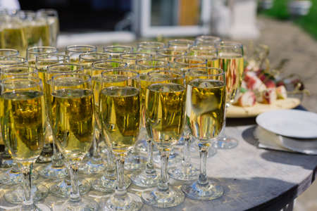 Glasses of champagne on the buffet table for guests.