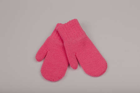Children's winter gloves on a white backgroundの写真素材