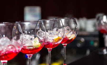 Glasses with a filling for a cocktail on the tableの写真素材