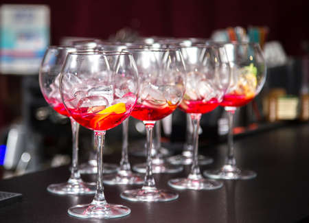 Glasses with a filling for a cocktail on the tableの写真素材