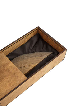 Souvenir of oak in a wooden box on a white background, isolate.