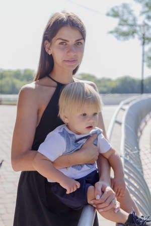 Beautiful young mother with her little son.