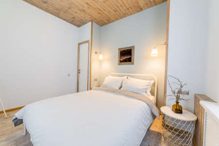 Luxurious stylish and cozy bedroom interior in the house.