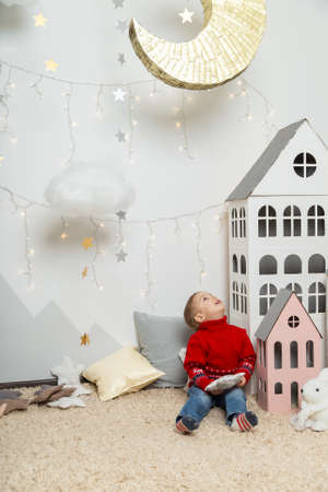 Beautiful happy boy in a New Years decor. Happy Merry Christmas 2020.の写真素材