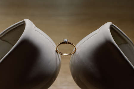 Shoes of the bride with wedding rings. Happy wedding dayの写真素材