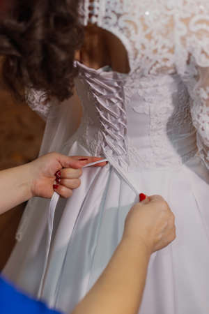 Beautiful happy bride knotted dress. Wedding dayの写真素材