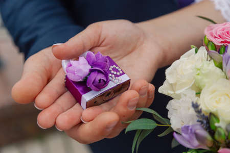 Beautifully designed lock in the hands of the newlywedsの写真素材