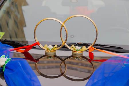 Beautiful floral decoration is on a wedding car.の写真素材