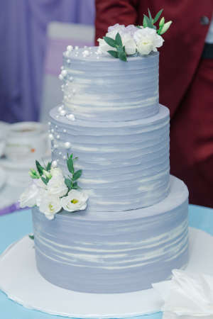 Beautiful wedding cake at a banquet on a happy wedding day