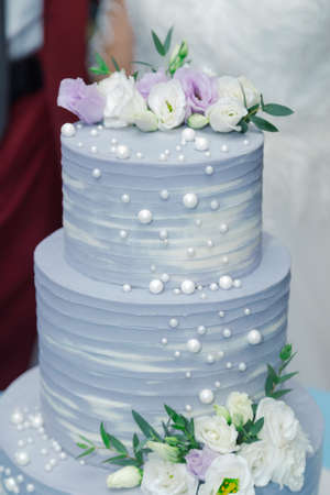 Beautiful wedding cake at a banquet on a happy wedding day.の写真素材