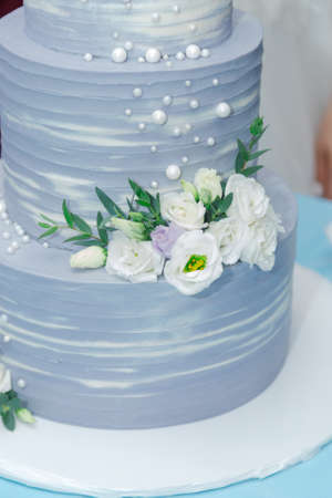Beautiful wedding cake at a banquet on a happy wedding day.