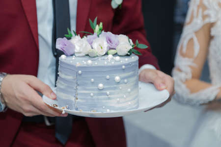 Beautiful wedding cake at a banquet on a happy wedding day.の写真素材