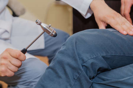 Doctor neurologist examines a patient in a clinic.