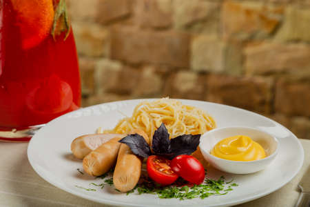 Fresh sausages with pasta and cheese sauce.