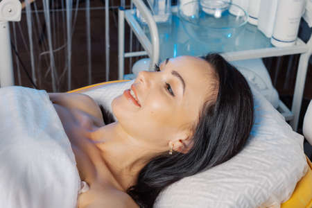 Beautiful woman before a cosmetic procedure in a cosmetic clinic.