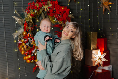 Beautiful and happy mom and son on new years day.の写真素材