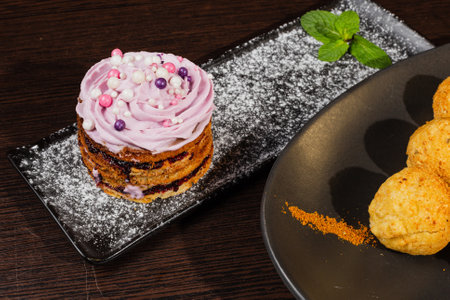 Beautifully decorated first course and dessert on the same table in a restaurant. quality food serviceの写真素材