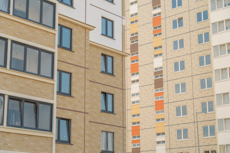 Facade of a modern residential building. New building in the city. many windowsの写真素材