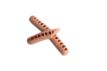 Delicious meat sausages in a cut on a white background. with traces of grilled chickenの写真素材