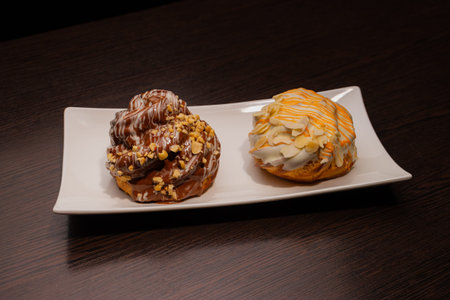 Pastry on a white plate and on a wooden table
