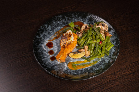 Fried salmon with vegetables and mushrooms