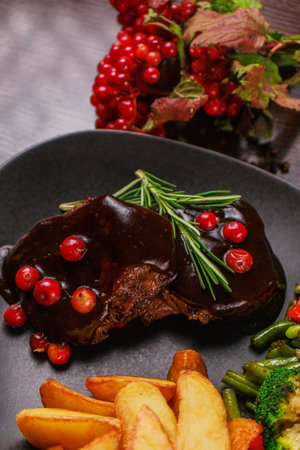 A plate of fried meat, fried potatoes and vegetablesの写真素材