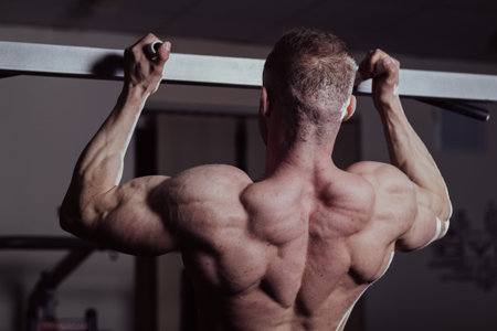 Bodybuilder training in the gym, aesthetic body