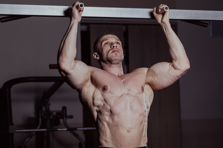Bodybuilder training in the gym, aesthetic body