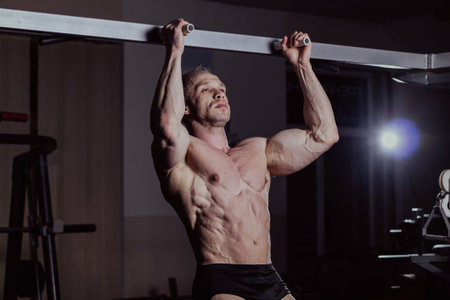 Bodybuilder training in the gym, aesthetic body