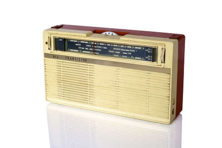 Vintage radio in red beige plastic housing from france on white backgroundの写真素材