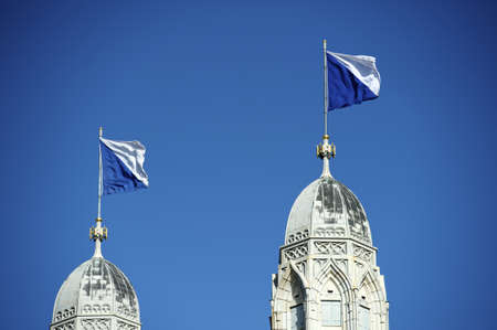 Grossmunster cathedral with flagged steeples, Zurich, Switzerland