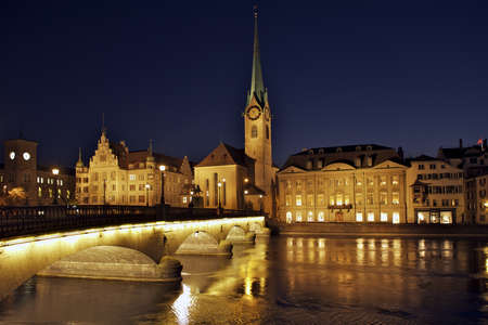 Fraumunster cathedral with river Limmat and munster bridge, Zurich, Switzerlandの写真素材