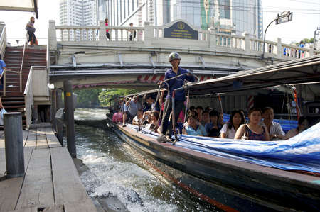 Bangkok, Thailand - February 25, 2011: Public express boat along the canal Khlong Saen Saeb (Saep) arriving at Pratunam pier.のeditorial素材