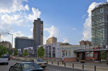 Beirut - Lebanon, October 16, 2008: View over construction site to the old Holiday Inn Hotel which has been distroyed by heavy artillery missile while the Beirut Civil War. This empty building is a legendary landmark of Beirut and is located close to the のeditorial素材
