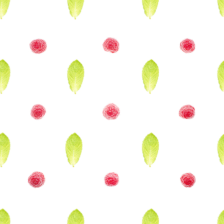 Background pattern of ripe raspberries and green mint leaves on white, top viewの写真素材