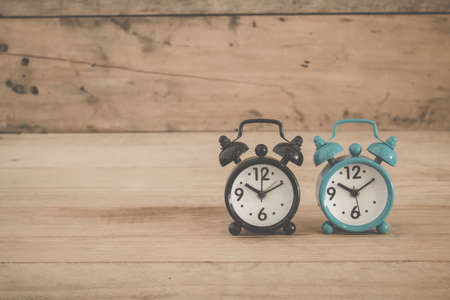 alarm clock on a table. Photo in retro color image styleの写真素材