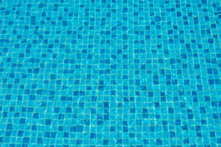 Water in a blue swimming pool, background