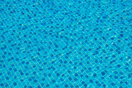 Water in a blue swimming pool, background