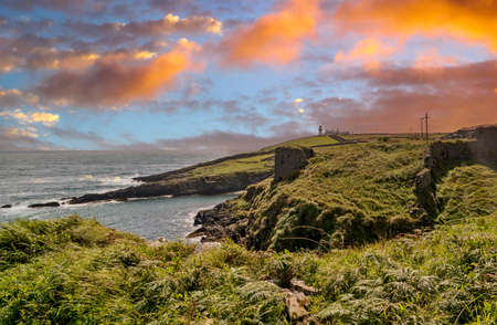 View to Galley Head Lighthouse on picturesque coastline in County Cork,Ireland.の写真素材