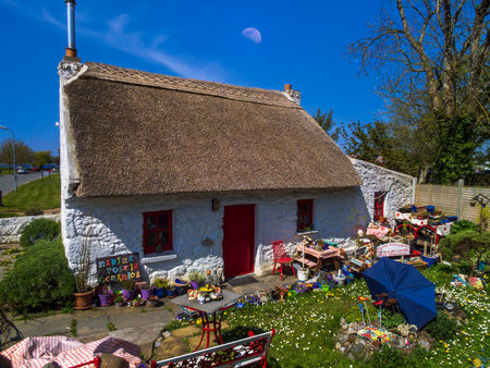 Picturesque thatched cottage in the village of Dromineer, County Tipperary, Ireland.It is uninhabited and is just tourist attraction.の写真素材