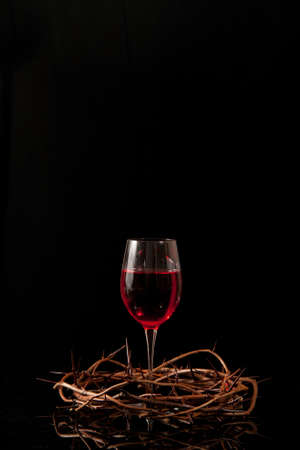 Communion wine in a crown made of thornsの写真素材