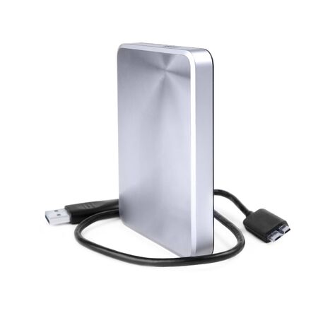 External silver hard disk drive 2.5 inches with a usb cable isolated on white.