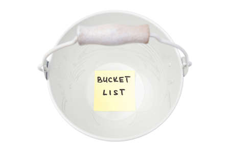 Empty bucket with a sticker note at the bottom reading BUCKET LIST.の写真素材