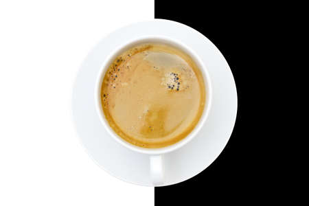 Espresso cup with a white saucer on a contrast black and white backgroundの写真素材