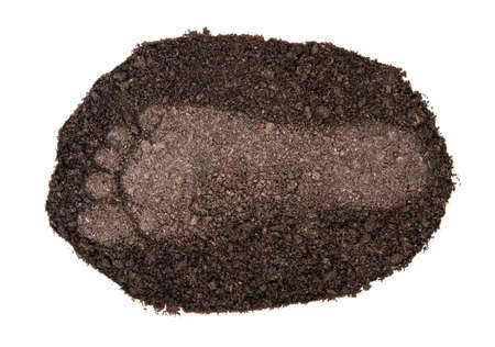 Human footprint on a small soil spot isolated on white background. Crisis of soil deterioration and erosion due to anthropogenic abuses.の写真素材